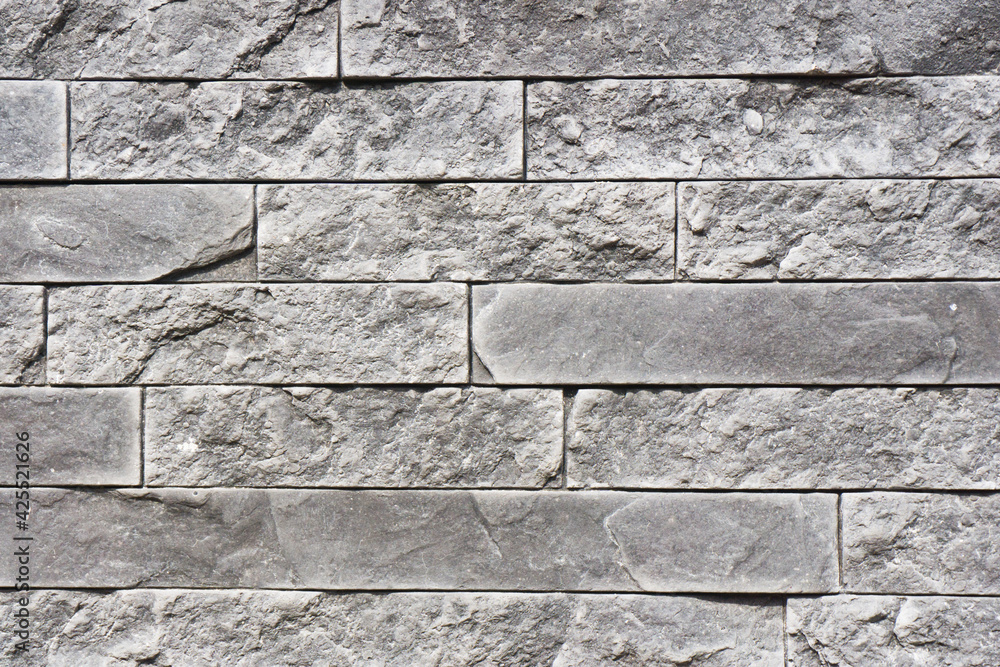 Gray house facade background. Gray brick wall texture. Decorative stone ...