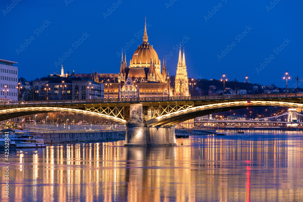 Evening in Budapest, Parliament against the background of the Margaret Bridge, the reflection of lights in the water