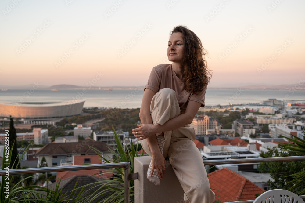 Young woman chilling outdoor in Cape town during sunset