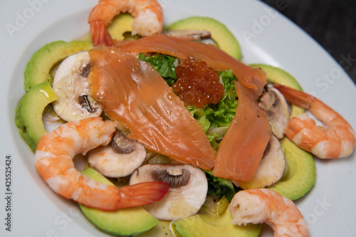Healthy breakfast with salmon, salad, avocado mushroom, salmon egg, red onion, High quality photo