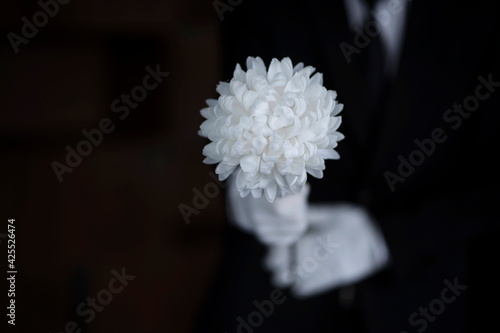Bereaved holding flowers at funeral