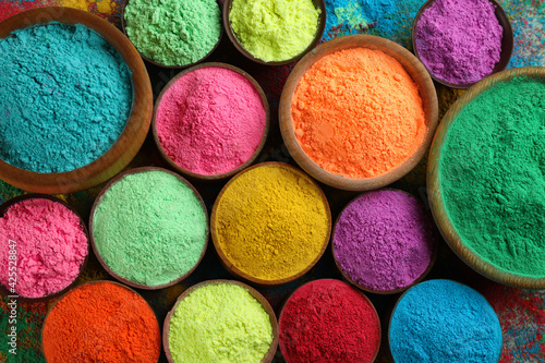 Colorful powder dyes as background, top view. Holi festival © New Africa