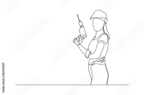 Continuous line drawing of young handy woman wearing uniform while holding drill machine. Single one line art of repair woman construction maintenance service concept. Vector illustration