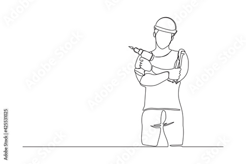 Continuous line drawing of young handyman wearing uniform while holding drill machine. Single one line art of repairman construction maintenance service concept. Vector illustration