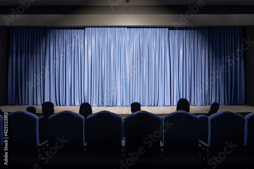 Projector light on blue backstage with copyspace in performance hall and spectators on seats. 3D rendering, mock up