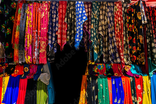Rolls of fabric and textiles in a factory shop. Multi different colors and patterns on the market Fabrics in rolls. Fabric store  © AMAR