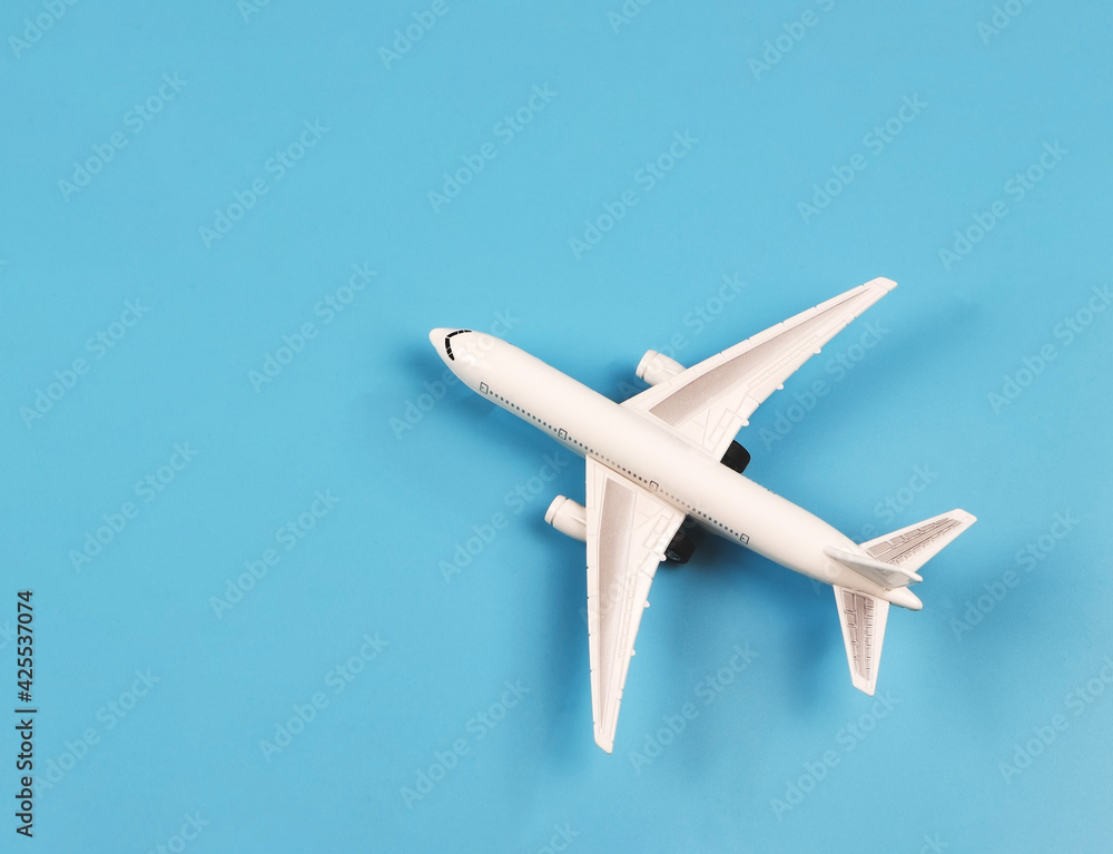 flat lay of airplane model on blue background.