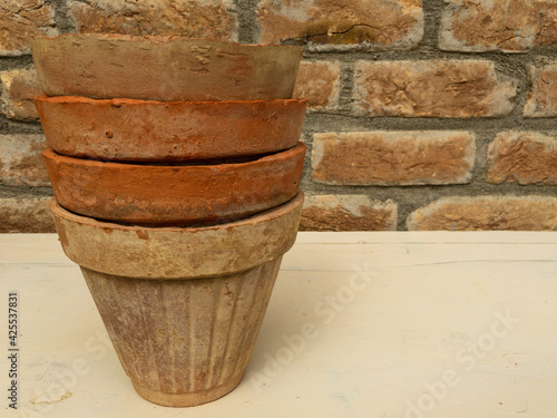 Old pots piled close up look with a text space