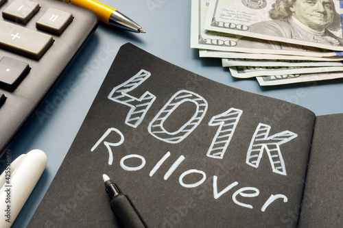 401k rollover memo on the notepad and cash.
