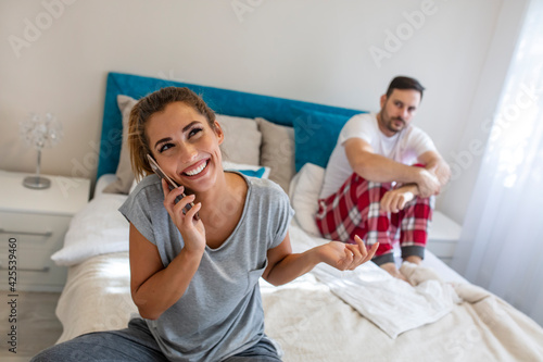 Couple problems. Husband is frustrated upset and unsatisfied while his internet addict wife is using mobile phone in social network. Jealous boyfriend spying his girlfriend's phone.