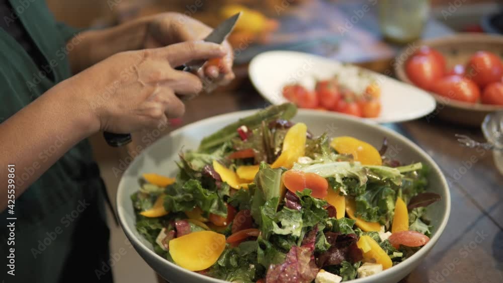 woman preparing cooking making vegetable salad in kitchen woman preparing cooking making vegetable salad in kitchen
