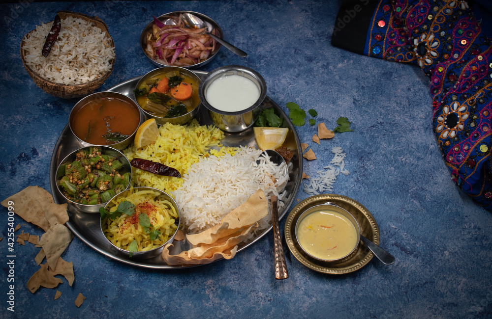 South Indian vegetarian thali meal on blue table Stock Photo | Adobe Stock