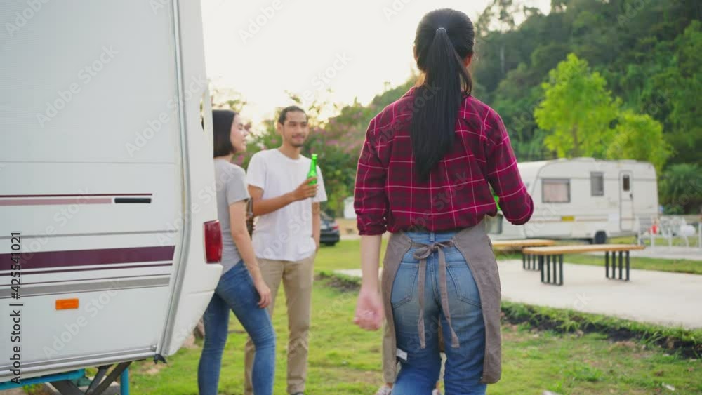 Group of friend drinking beer and dancing together while camping. Group of friend drinking beer and dancing together while camping.