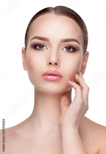 Beauty Portrait of Young Woman with Perfect Clean Fresh Skin close up isolated on white background - Skin Care Concept..