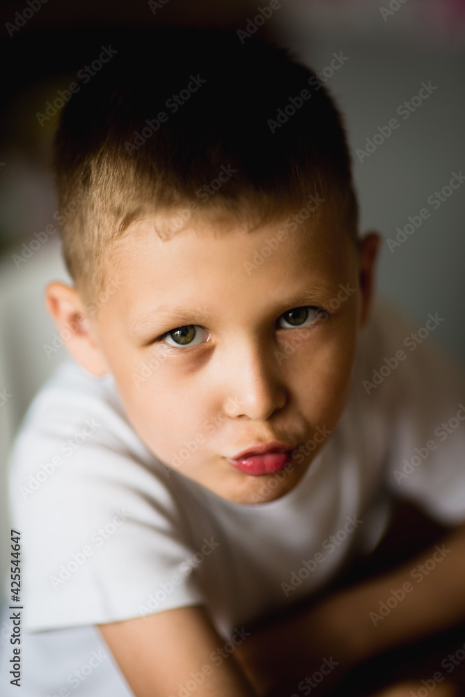 emotional, cheerful portrait of a boy on a dark background, selective focus emotional, cheerful portrait of a boy on a dark background, selective focus