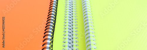 Bright school notebooks background. Back to school soon. Copy space.
