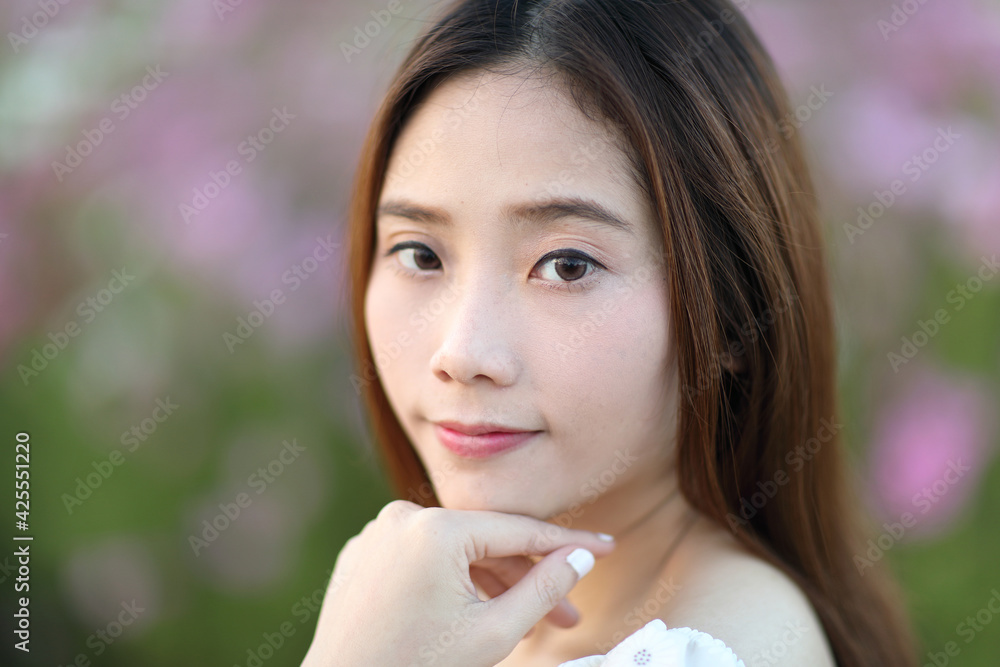 Beautiful young woman with white dress on garden background Beautiful young woman with white dress on garden background
