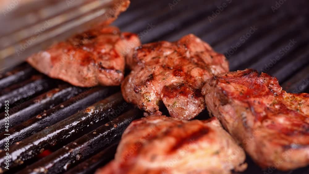 Grilled meat on the grill in 4k 10 Bit at 120 FPS slow motion Grilled meat on the grill in 4k 10 Bit at 120 FPS slow motion