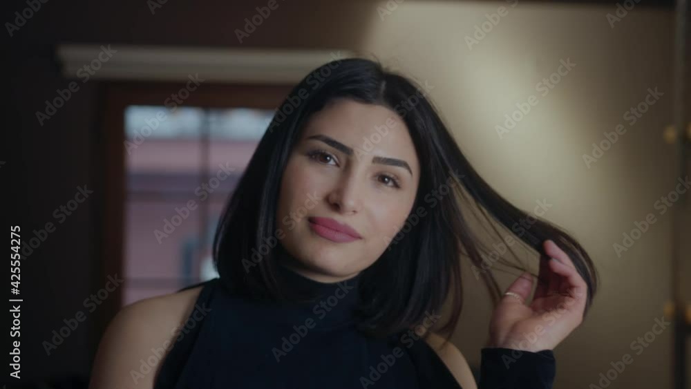 Beautiful young woman looking at the camera and posing, lifestyle and fashion concept Beautiful young woman looking at the camera and posing, lifestyle and fashion concept