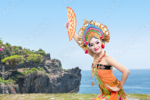 Asian woman dancing Balinese traditional dance (Kembang Girang dance)
