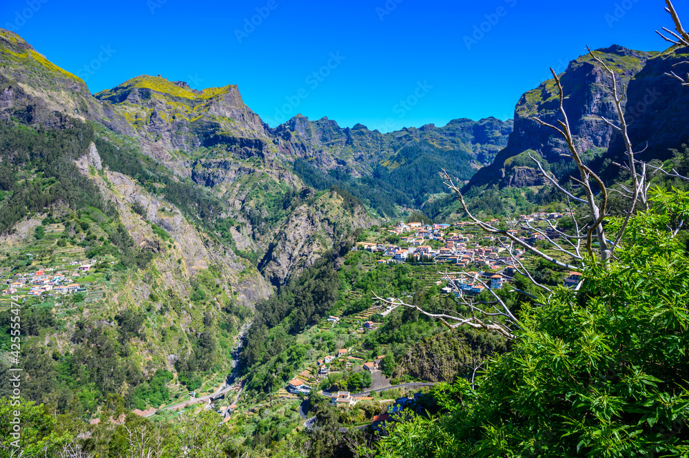 View of Curral das Freiras village in the Nuns Valley in beautiful mountain scenery, municipality of Câmara de Lobos, Madeira island, Portugal.