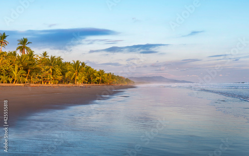 Beautiful sunset sky on the beach in Matapalo, Costa Rica. Central America. Sky background on sunset. Tropical sea. photo