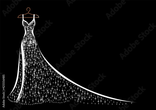 Fotografia, Obraz Hanging on a hanger is a beautiful lace and sparkly dress for wedding, evening or prom