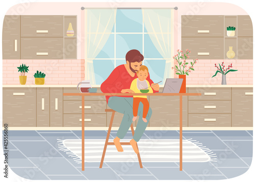 Dad feeds baby wearing bib in kitchen. Kid sits on his dad s lap, eats and watches cartoon on laptop
