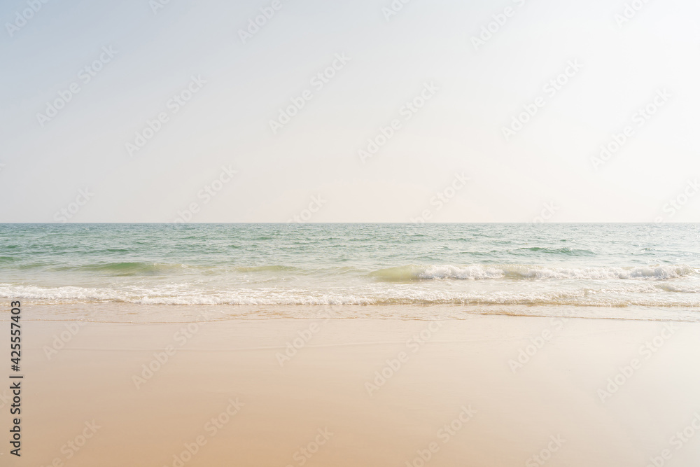 Sea and sand on tropical beach for background.
