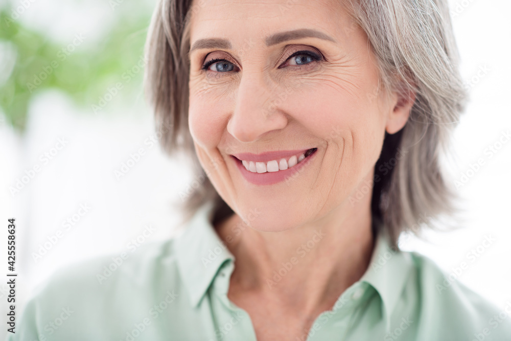 Photo of charming positive nice old grandmother smile good mood face vacation indoors inside house home