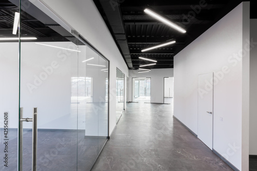 Interior photography, large spacious office center, with panoramic windows and unfurnished glass doors