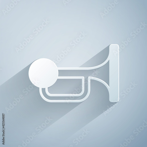 Paper cut Signal horn on vehicle icon isolated on grey background. Paper art style. Vector