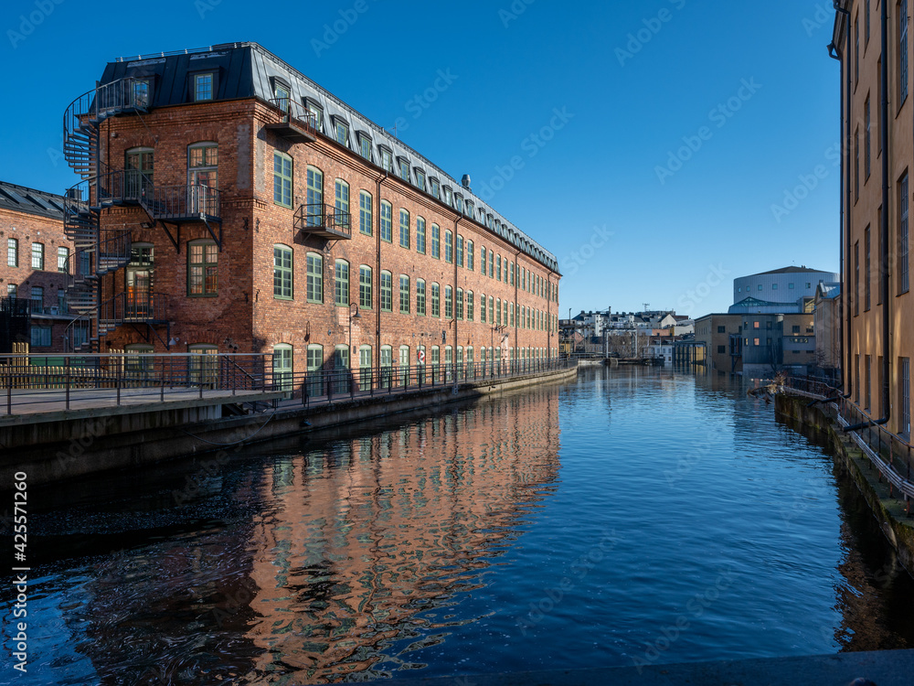 The old industrial landscape and Motala stream during spring. Norrkoping is a historic industrial town in Sweden.