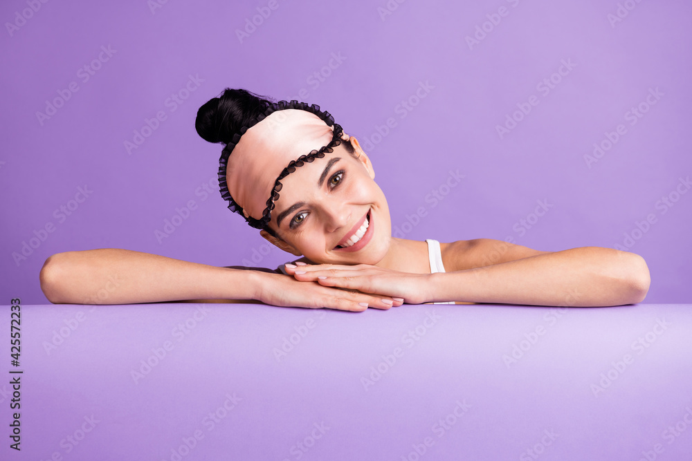 Photo portrait of cute girl wearing sleeping mask top knot smiling isolated on pastel purple color background with empty space Photo portrait of cute girl wearing sleeping mask top knot smiling isolated on pastel purple color background with empty space