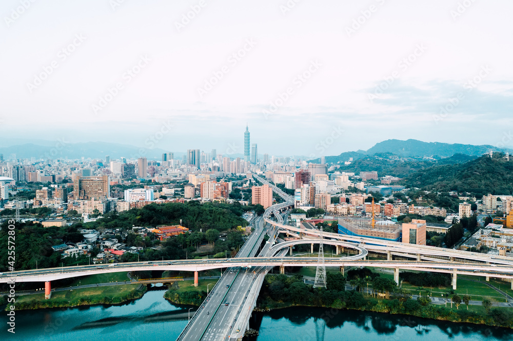 Obraz premium Taipei City Aerial View - Asia business concept image, panoramic modern cityscape building bird’s eye view under sunrise and morning blue bright sky, shot in Taipei, Taiwan