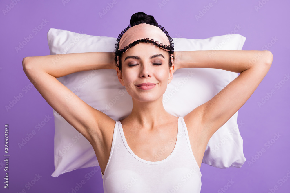 High angle view photo of young dreamy charming positive girl sleeping daydreaming isolated on purple color background High angle view photo of young dreamy charming positive girl sleeping daydreaming isolated on purple color background
