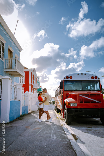 Curacao, colorful bouldings around Willemstad Punda and Otrobanda Pietermaai district, multicolored homes in Pietermaai Curacao Caribean Island , couple men and woman on vacation Curacao photo