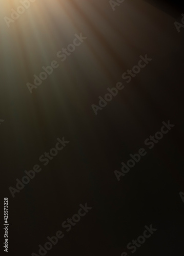 
flare of light on a black background. abstract spotlight background