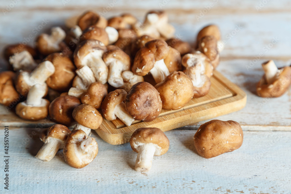 .Fresh shiitake mushrooms on the wooden kitchen table .Fresh shiitake mushrooms on the wooden kitchen table