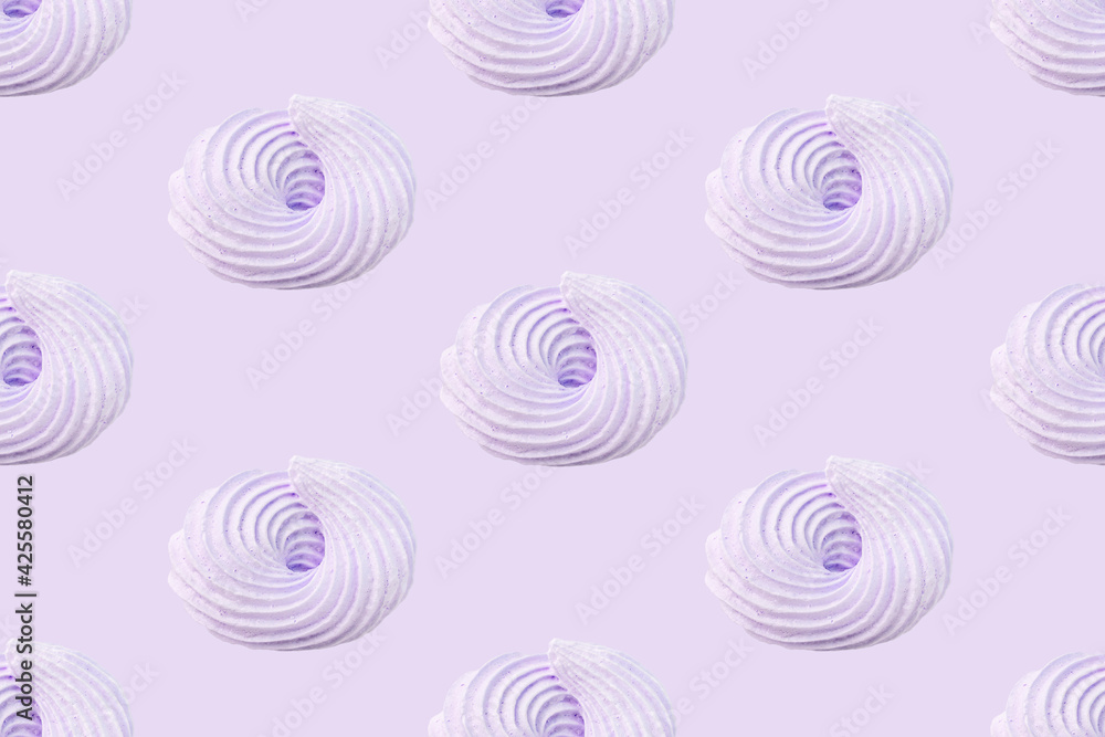 Meringue candy pastel colors seamless pattern light purple background. French pastries, sweet swirls of marshmallows. Whipped dessert, egg cream and sugar. Wallpaper, textiles, wrapping paper print