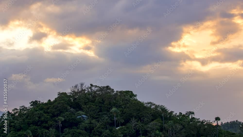 Time Lapse cloudy sunset over mountain peak Time Lapse cloudy sunset over mountain peak