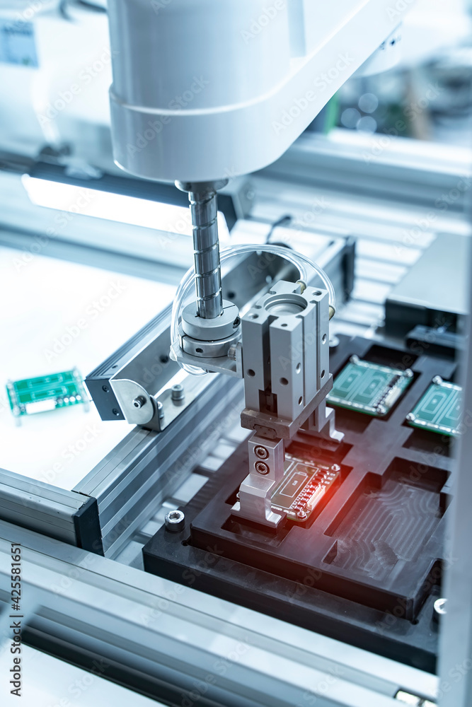 automatic robot for print circuit board (PCB)assembly machine during soldering or welding part at factory automatic robot for print circuit board (PCB)assembly machine during soldering or welding part at factory