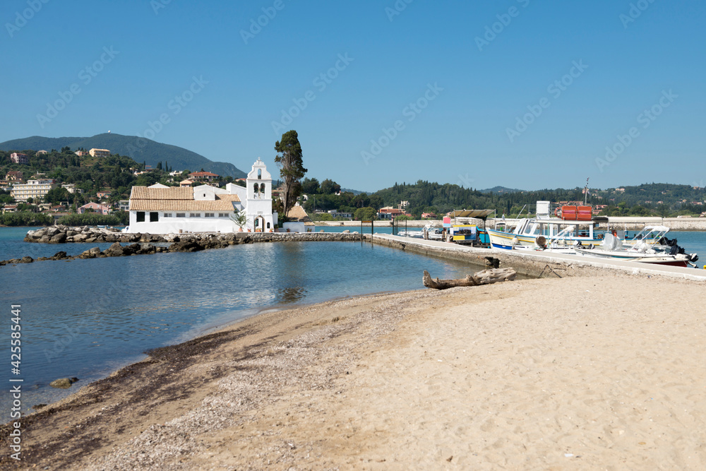 View of famous Vlacherna Monastery and fisherman boats in Halikiopoulou lagoon, Kanoni, Corfu Island, Greece    
