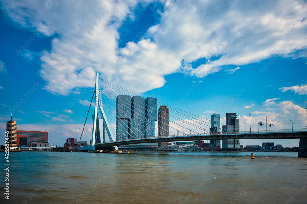 View of Rotterdam sityscape with Erasmusbrug bridge over Nieuwe Maas and modern architecture skyscrapers