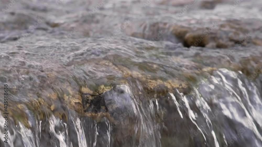 Close-up shot of turbulent and cascading rapids in a river