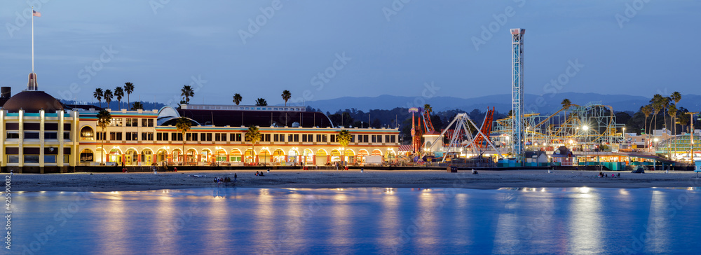 Santa Cruz, California - April 3, 2021: Santa Cruz Beach Boardwalk Amusement Park during the blue hour. Santa Cruz, California, USA.