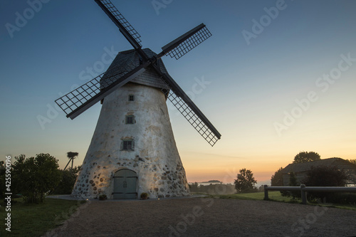 Traditional Old dutch windmill in Latvia. Sunrise to Araisi windmill in Vidzeme.