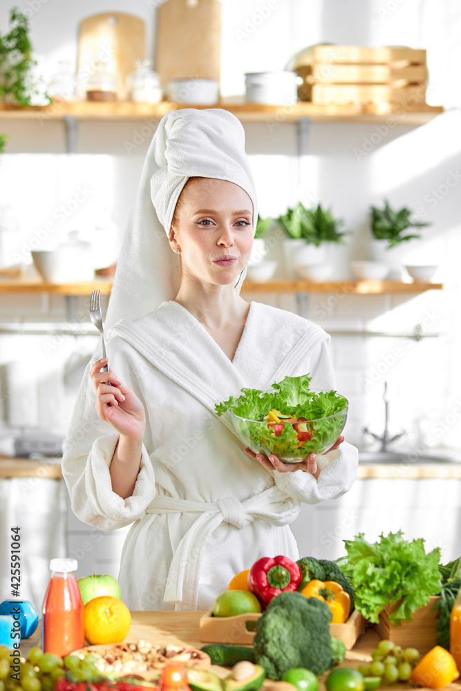 Cheerful Woman In Bathrobe Eating Vegetable Salad From Bowl Enjoying Healthy Nutrition Cheerful Woman In Bathrobe Eating Vegetable Salad From Bowl Enjoying Healthy Nutrition
