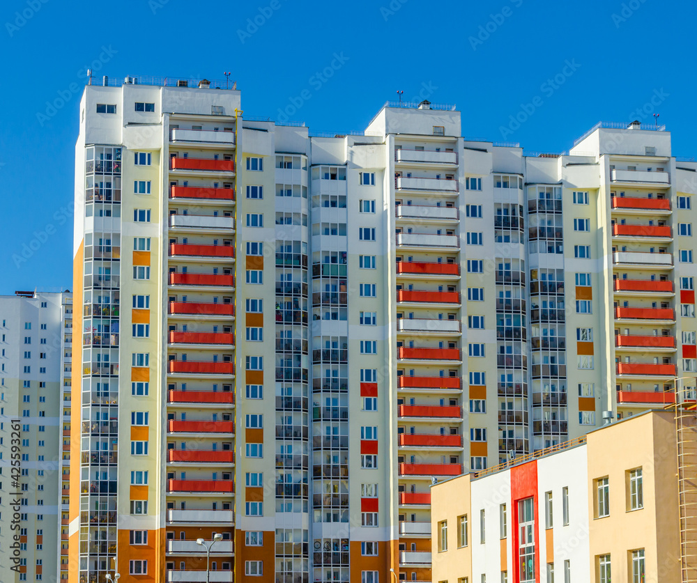 Multi-storey residential building on a sunny day.