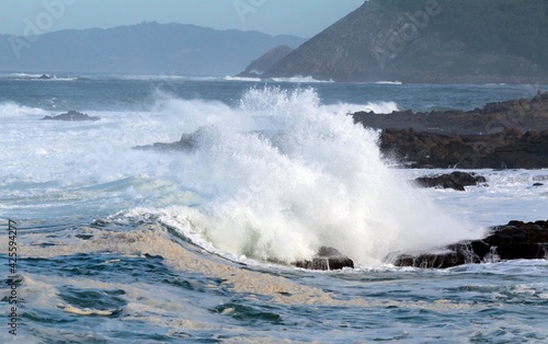 Foamy waves come to shore